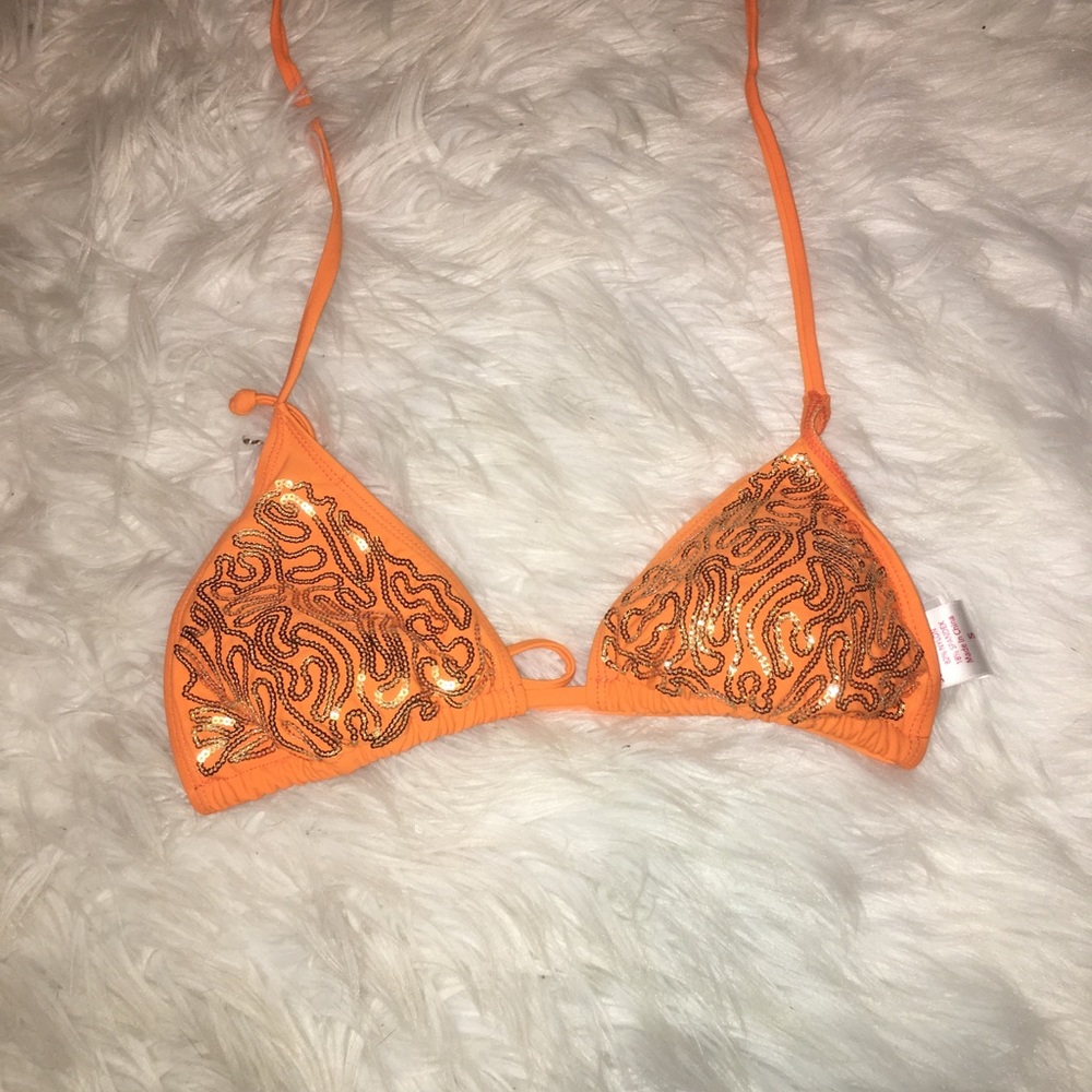 Orange swim suit with gold embellishment